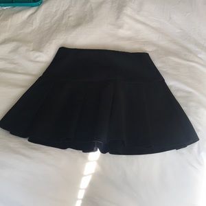 Black pleated mini skirt